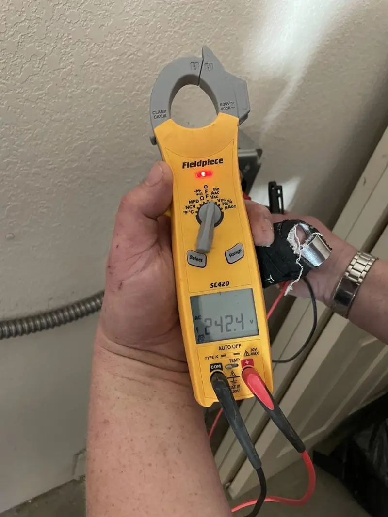 Voltage testing with clamp meter during Circuit Breaker Repair in Elgin